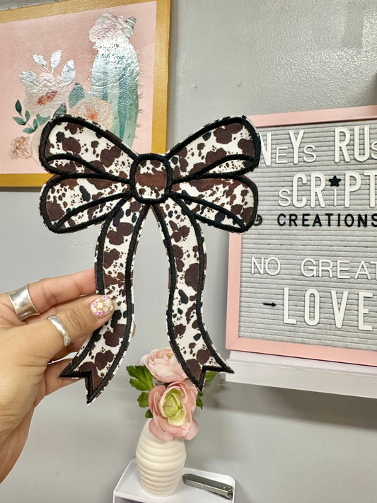 Cowhide pattern bows and filler patches