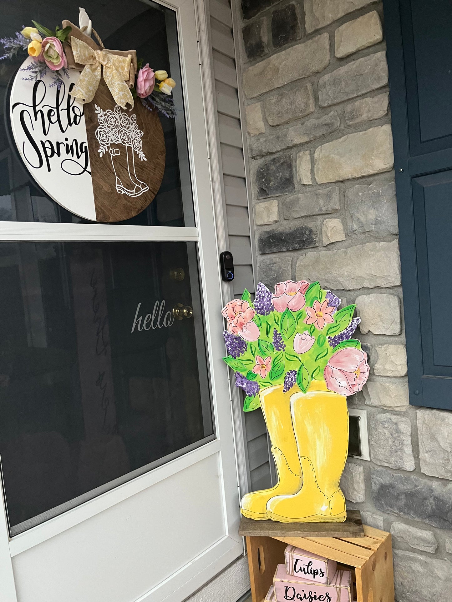 Spring yellow boots with flowers yard art