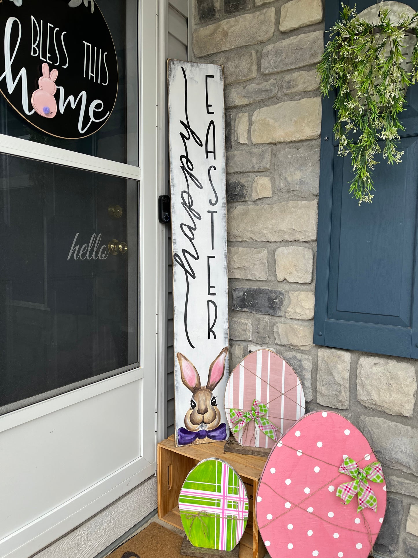 Happy Easter welcome sign with a painted bunny