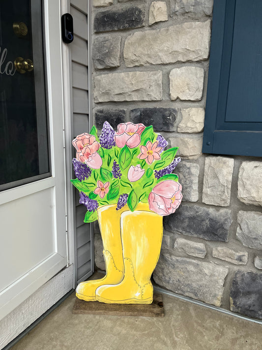 Spring yellow boots with flowers yard art