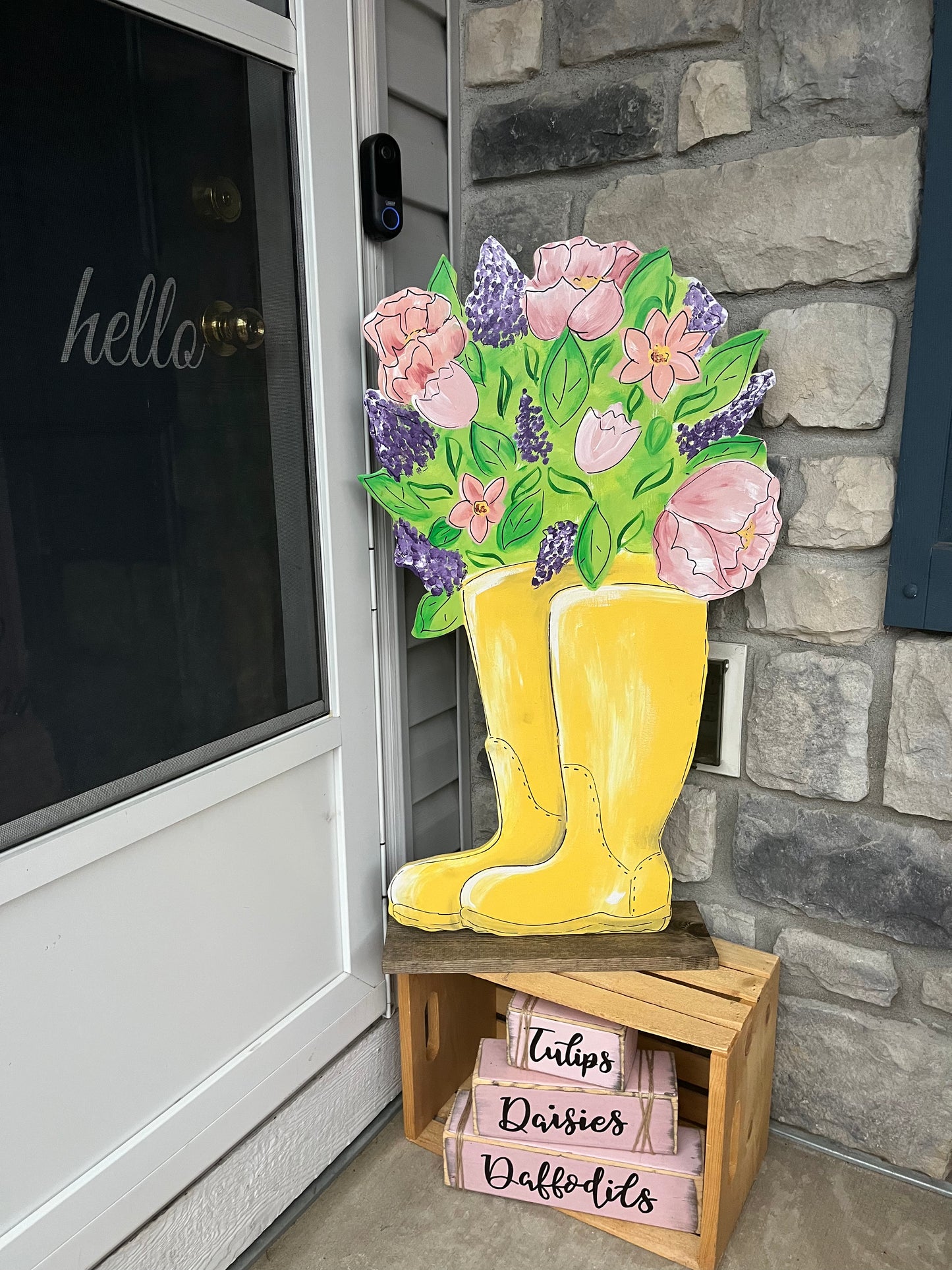 Spring yellow boots with flowers yard art